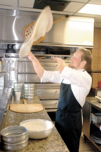 Tossing the dough isn’t just for show
